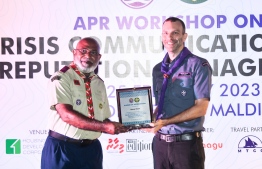 David Venn, Global Director Communications world scout Bureau global support centre (Right) receives plaque of appreciation from President of the Scout association of Maldives Mohamed Nazeef (Left) -- Photo: Fayaz Moosa / Mihaaru