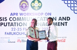 Mohamed Solah, Admin & IT Director (Right) receives plaque of appreciation given to event partners on behalf of Hulhumalé Development Corporation (HDC) from Former Regional Director of World Scout Bureau Asia Pacific Support Centre Abdulla Rasheed (Left) -- Photo: Fayaz Moosa / Mihaaru