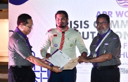 (Center) Hussain Mohamed Haneef, Deputy Chief Commissioner Scouting development, Scout Association of Maldives receives Certificate of Good Service to the Asia-Pacific region from (Left) JR Pangilinan, Regional Director, World Scout Bureau Asia Pacific Support Centre and (Right) Rafiqul Islam Khan, member Asia Pacific regional Scout Committee -- Photo: Fayaz Moosa / Mihaaru