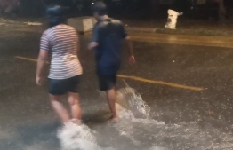 Reconstructed parts of Ameenee Magu were flooded following Monday night's rainfall-- Photo: Aafaaq Mohamed | Twitter