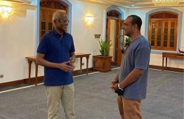 President Ibrahim Mohamed Solih (L) with Ibrahim Shaaz (R) after a meeting in Muliaage --
