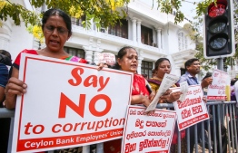 Members of the banks trade union stage a protest to propose tax reforms for country's economic crisis in Colombo on March 14, 2023. Photo: AFP