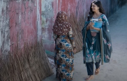 A shot of Malavika Mohanan (L), the actress playing Christy, with a Maldivian woman in the movie Christy --