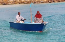 Ahmed Mohamed and Azeema on their dinghy; the exceptional couple from F. Nilandhoo. PHOTO: ISMAIL NASEER / MIHAARU