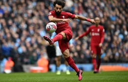 Liverpool's Egyptian striker Mohamed Salah has an unsuccessful shot during the English Premier League football match between Manchester City and Liverpool at the Etihad Stadium in Manchester, north west England, on April 1, 2023. -- Photo: Paul Ellis / AFP