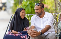 MDP candidate Ibrahim Shaz speaking to a elderly woman during the by-election campaign