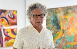 Artist Tony Seker speaks about his inspiration for his paintings -- Photo: Amaany Abdulla
