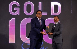 The Managing Director of Steel Hardware Ali Fauzee receives the company's first 'Gold 100' win-- Photo: President's Office