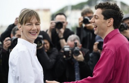(From L) German actress Sandra Huller and German actor Christian Friede pose during a photocall for the film "The Zone Of Interest" at the 76th edition of the Cannes Film Festival in Cannes, southern France, on May 20, 2023. -- Photo: Patricia De Melo Moreira / AFP