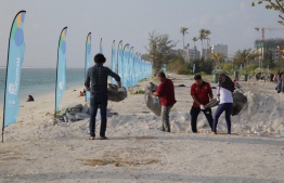 People clean the beach area during an event held to clean Hulhumale'.
Photo -- HDC