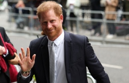Britain's Prince Harry, Duke of Sussex, waves as he arrives to the Royal Courts of Justice, Britain's High Court, in central London on June 7, 2023. Prince Harry testified he had suffered lifelong "press invasion" and that some media had blood on their hands, as he became the first British royal in more than 100 years to give evidence in court. -- Photo: Adrian Dennis / AFP