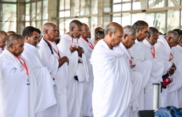Individuals praying at Velana International Airport before Departure for Hajj last year