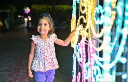 A child at the decorative lights set by Male City Council to celebrate Eid Al Adha -- Photo: Nishan Ali / Mihaaru