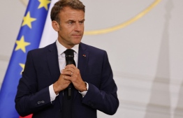 France's President Emmanuel Macron addresses mayors of cities affected by the violent clashes that erupted after a teen was shot dead by police last week during a meeting at the presidential Elysee Palace in Paris on July 4, 2023. -- Photo: Ludovic Marin / AFP