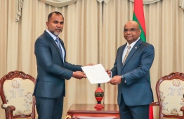 Minister of Foreign Affairs hands letter of appointment to Ali Fauzee, the new Maldivian honorary consul to Russia-- Photo: Ministry of Foreign Affairs