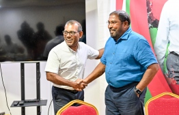 Parliament Speaker Mohamed Nasheed greets Jumhooree Party leader Qasim Ibrahim at the meeting held to discuss nomination of a single candidate for this year's presidential election -- Photo: Nishan Ali