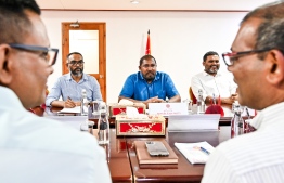 At a meeting held to discuss nomination of a single candidate for this year's presidential election, members of The Democrats along with Parliament Speaker Mohamed Nasheed (L), Jumhooree Party leader, Qasim Ibrahim (C) and Maldives National Party leader Mohamed Nazim (R) -- Photo: Nishan Ali