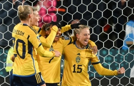 Sweden's forward #15 Rebecca Blomkvist (R) celebrates scoring her team's first goal during the Australia and New Zealand 2023 Women's World Cup Group G football match between Argentina and Sweden at Waikato Stadium in Hamilton on August 2, 2023. -- Photo: Saeed Khan / AFP