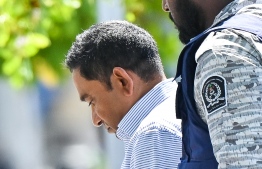 Former President Abdulla Yameen arrives at the court hearing today: According to the Elections Commission, if the law is interpreted to allow Yameen to contest in the presidential election, major criminal convicts will have the opportunity to occupy senior positions of the State -- Photo: Fayaz Moosa