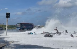 Picture showing vehicles and people being swept away on the Sinamale' bridge, with the high surge waves