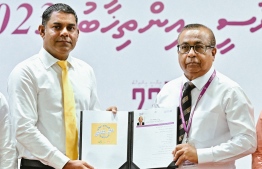 President Ibrahim Mohamed Solih’s candidacy form handover to Elections CommissionChief Fuad Thaufeeq by the current President’s Campaign Manager Mohamed Nashiz. Photo: Nishan Ali