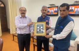 Sherpa Amitabh Kant and Chief Coordinator Harsh Shringla presenting G20 coins and stamps to India's Minister of External Affairs Dr. S. Jaishankar