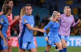 England's players celebrate their team's victory in the Australia and New Zealand 2023 Women's World Cup semi-final football match between Australia and England at Stadium Australia in Sydney on August 16, 2023. -- Photo: Franck Fife / AFP