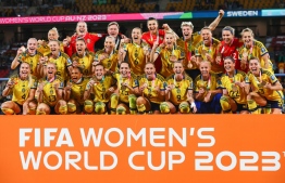 Sweden players celebrate with their bronze medals after winning the Australia and New Zealand 2023 Women's World Cup third place play-off football match between Sweden and Australia at Brisbane Stadium in Brisbane on August 19, 2023. -- Photo: Patrick Hamilton / AFP