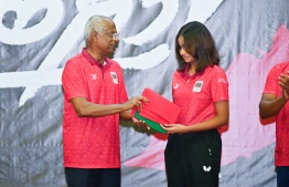 President Ibrahim Mohamed Solih presenting Dheema with the national flag -- Photo: President's Office