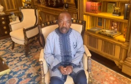 This video grab made from an unconfirmed video at an undisclosed location obtained by AFPTV on August 30, 2023 shows Gabon's deposed president, Ali Bongo Ondimba, calling on "his friends around the world to make some noise" while under house arrest. Rebel officers in the oil-rich central African state of Gabon announced on August 30, 2023 they had seized power following disputed elections in which President Ali Bongo Ondimba, in power since 2009, had been declared victor.
Bongo, 64, whose family has ruled Gabon for over 55 years, was placed under house arrest and one of his sons arrested for treason, the coup leaders said. -- Photo by UNKNOWN SOURCE / AFP