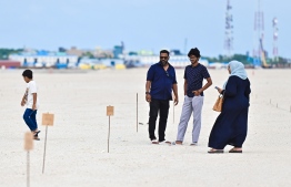 Recipients issued land from Gulhi Falhu inspecting the allocated land at the reclaimed lagoon. -- Photo: Nishan Ali / Mihaaru News