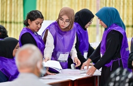Officials at a polling station-- Photo: Fayaz Moosa | Mihaaru