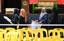 Officials taking ballot boxes to polling booths before voting begins-- Photo: Fayaz Moosa | Mihaaru