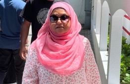 Former First Lady Fathimath Ibrahim leave the venue after casting her vote