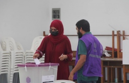 A voter casts her vote at Meedhoo polling station-- Photo: Ibrahim Rafhan | Mihaaru
