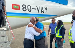President Solih (L) hugs JP's Leader Qasim Ibrahim upon arrival to Sun Island Resort to discuss possible coalitions for the second round of the election --