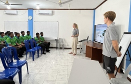 Dr. Katrina Himpson and marine biologist Edward Hodges giving a workshop on marine ecosystems of Maldives to students of Baa atoll schools -- Photo: Fathimath Shana