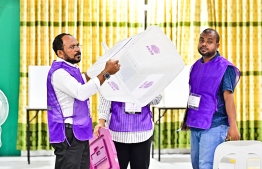 Elections officials show an empty ballot box to media ahead of polling--Photo: Fayaz Moosa