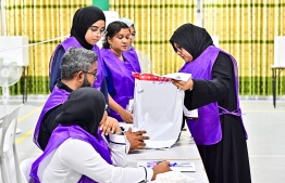 Elections officials busy making arrangements and getting ready for voters to cast their ballots in the runoff election-- Photo: Nishan Ali