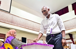 Progressive Party of Maldives (PPM) and People's National Congress (PNC) coalition’s candidate and Malé City Mayor, Dr. Mohamed Muizzu, casts his ballot -- Photo: Fayaz Moosa