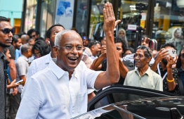 President Ibrahim Mohamed Solih raises his hand to show proof of casting his vote-- Photo: Nishan Ali