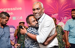 A supporter hugging Dr. Mohamed Muizzu during the press conference held after his win in the presidential election.
