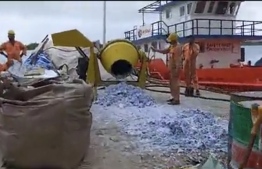 A still from a video circulating on social media, showing FSM destroy a large amount of paperwork in a concrete mixer.