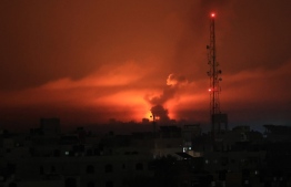 A fireball erupts during overnight Israeli bombardment in the Gaza Strip on October 24, 2023. Thousands of civilians, both Palestinians and Israelis, have died since October 7, 2023, after Palestinian Hamas militants based in the Gaza Strip entered southern Israel in an unprecedented attack triggering a war declared by Israel on Hamas with retaliatory bombings on Gaza. -- Photo: Said Khatib / AFP