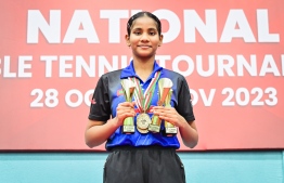 Dheema, with the three trophies she won in the National Tournament.-- Photo: Nishan Ali / Mihaaru