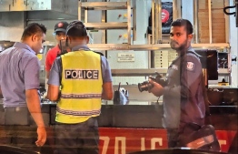 Police officers investigating the diesel attack on Pizza Hut outlet in Male' City-- Photo: MVCrisis