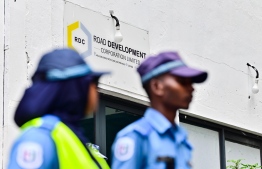 Police enter RDC premises yesterday under a court order for an ongoing investigation.-- Photo: Nishan Ali / Mihaaru