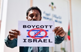 Image from the protests outside parliament calling for a ban on Israeli passports.-- Photo: Fayaz Moosa / Mihaaru