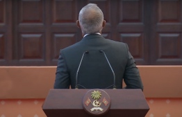 President Dr. Mohamed Muizzu briefly stops his inaugural speech to face the hoisted national flag of the Maldives-