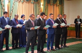 The new cabinet members taking oath of office at the ceremony held at the President's Office on Friday evening; the new government is comprised of 22 ministries-- Photo: President's Office